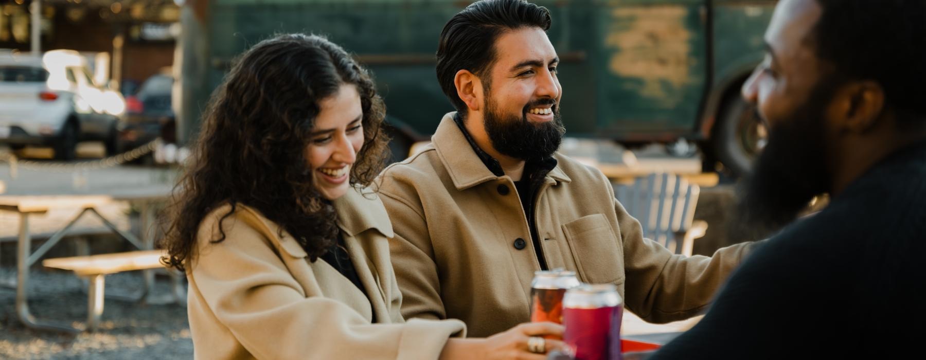 a group of people sitting at a table with drinks