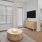 a living room with a tv and couches
